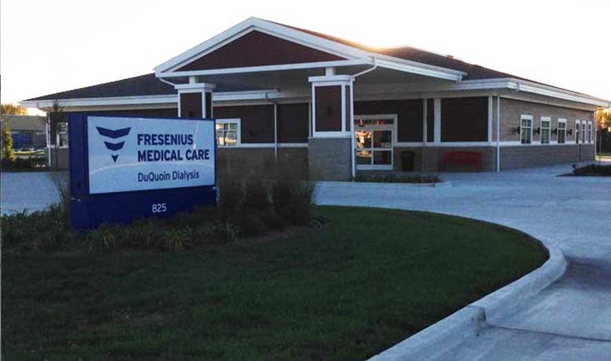 Fresenius Medical Care Center building exterior with sign displaying "Fresenius Medical Care DuQuoin Dialysis" at 825 Sunset Ave, showcasing A & W Plumbing and Heating, Inc.'s commercial plumbing installation.