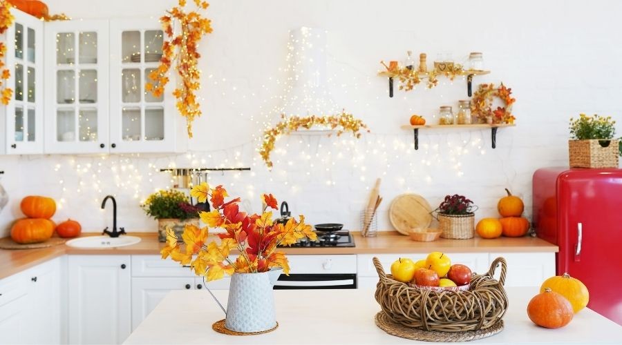 Cozy fall kitchen with pumpkins, gourds, and retro refrigerator; A & W Plumbing and Heating, Inc. service focus.